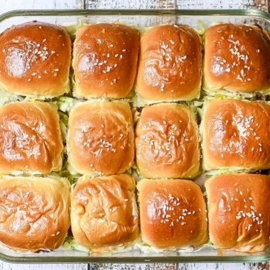 Big Mac sliders served on a plate with toppings and condiments