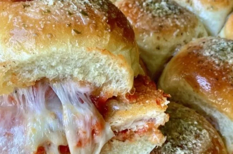 Delicious chicken nugget sliders served on a platter with dipping sauces.
