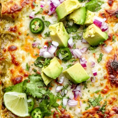 A delicious Green Chicken and Enchilada Casserole served in a baking dish