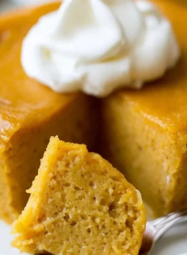 Delicious crustless pumpkin pie pudding topped with whipped cream