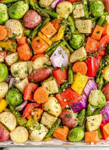 A colorful plate of oven-roasted vegetables with herbs and spices